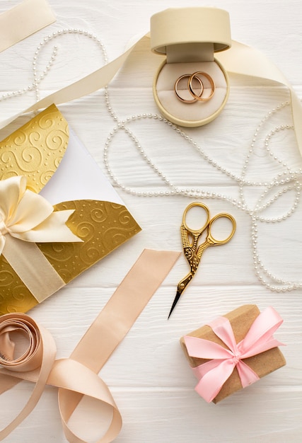 Top view arrangement of ribbons and wedding rings