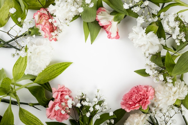 Top view arrangement of spring roses and leaves