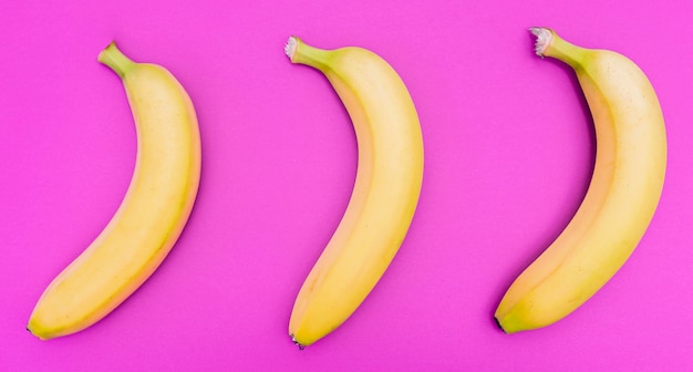 Free photo top view arrangement of three bananas