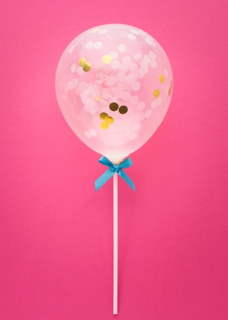 Free photo top view arrangement with balloon and blue ribbon