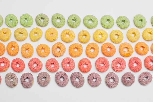 Top view arrangement with circular and colorful cereals