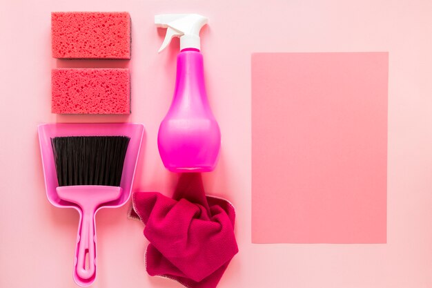 Free photo top view arrangement with cleaning products on pink background