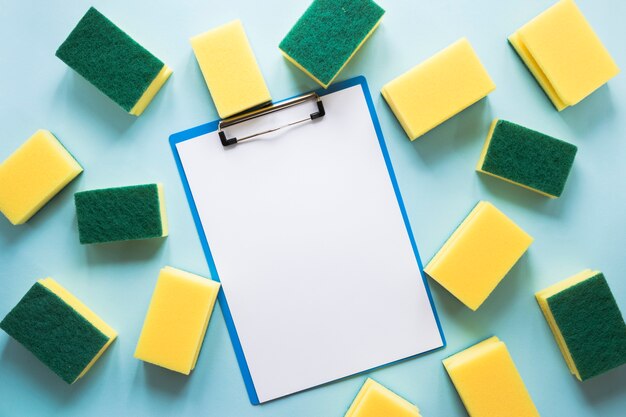 Top view arrangement with clipboard and sponges