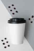 Free photo top view arrangement with coffee cup mock-up