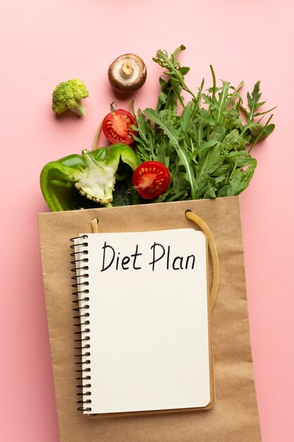 Top view arrangement with diet planning notepad