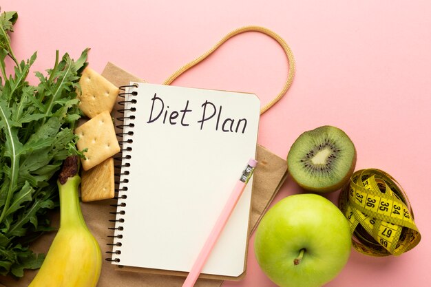 Top view arrangement with diet planning notepad