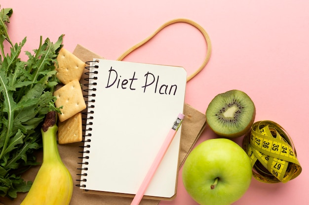Top view arrangement with diet planning notepad