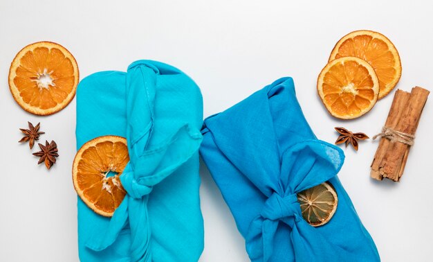 Top view arrangement with fabric and orange slices