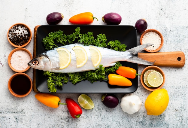 Top view arrangement with fish and vegetables