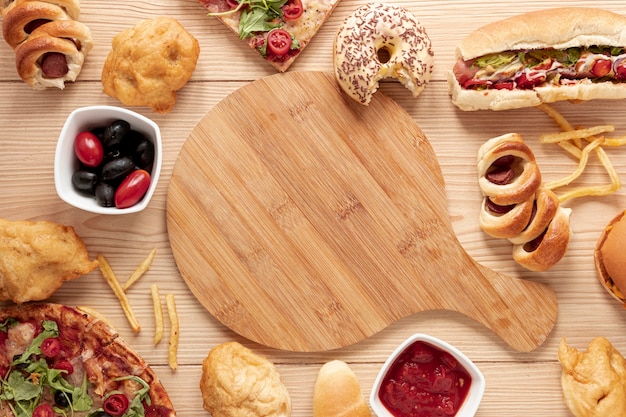 Top view arrangement with food and cutting board