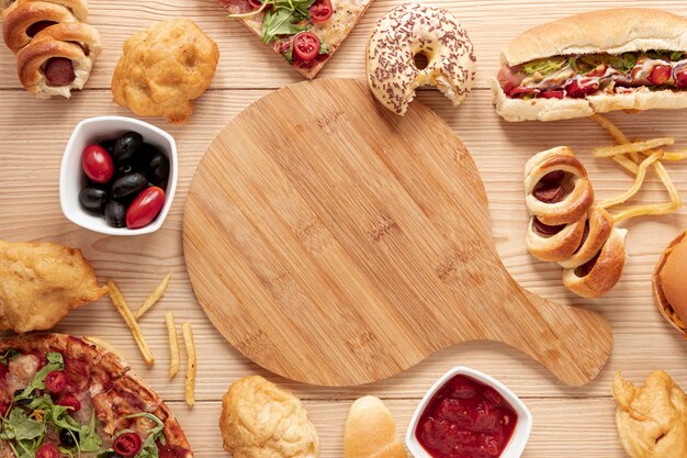 Top view arrangement with food and cutting board