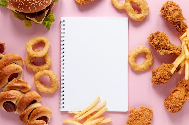 Top view arrangement with food and notebook