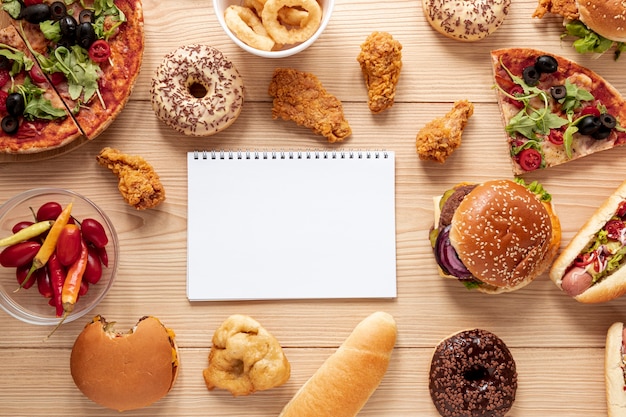 Top view arrangement with food and notebook