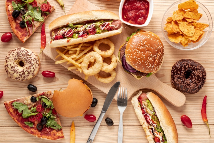 Free Photo top view arrangement with food on wooden background