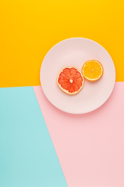 Top view arrangement with fruits on a plate