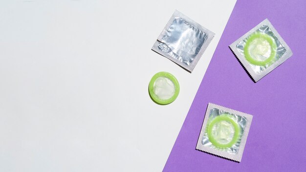 Top view arrangement with green condoms