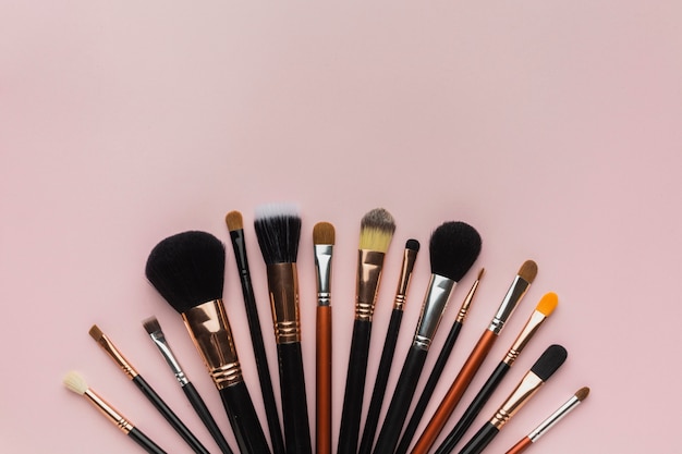 Top view arrangement with make-up brushes 