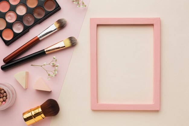 Top view arrangement with make-up items and frame