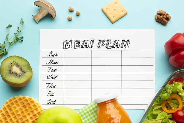 Free photo top view arrangement with meal planner