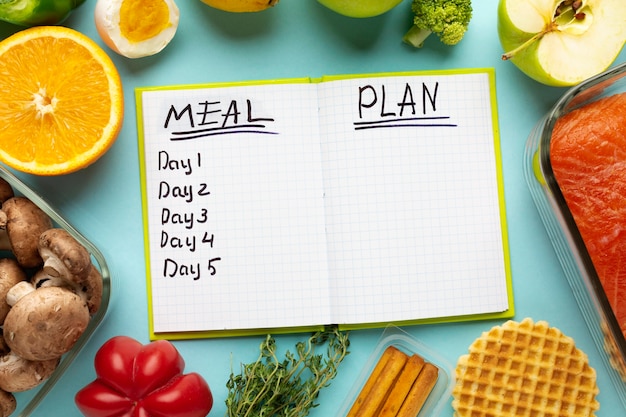 Top view arrangement with meal planning notebook