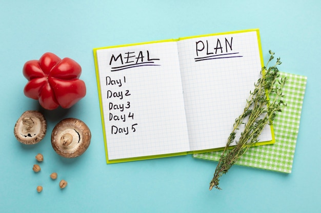 Top view arrangement with meal planning notebook