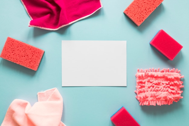 Top view arrangement with piece of paper and sponges