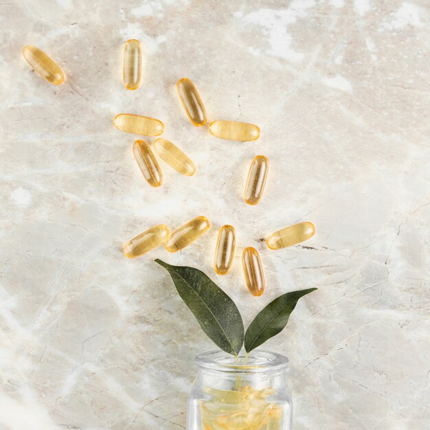 Top view arrangement with pills on marble background