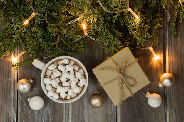 Top view arrangement with present and marshmallow drink