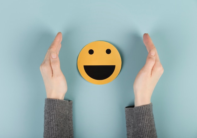 top view arrangement with a smiley emoji card