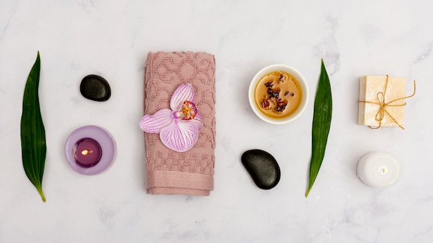 Top view arrangement with spa products on marble table