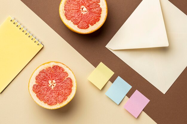 Top view arrangement with stationery elements and fruits