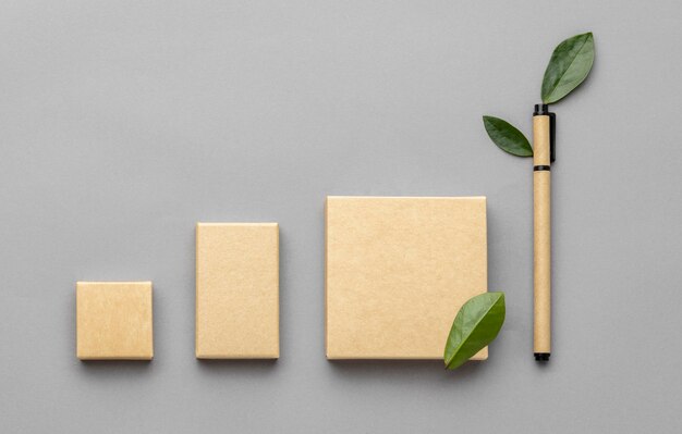 Top view arrangement with stationery elements on grey background