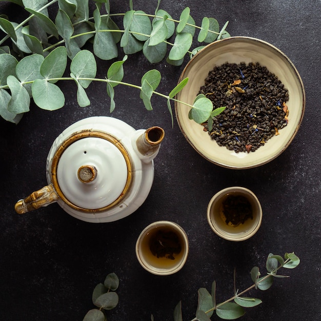 Top view arrangement with tea and herbs