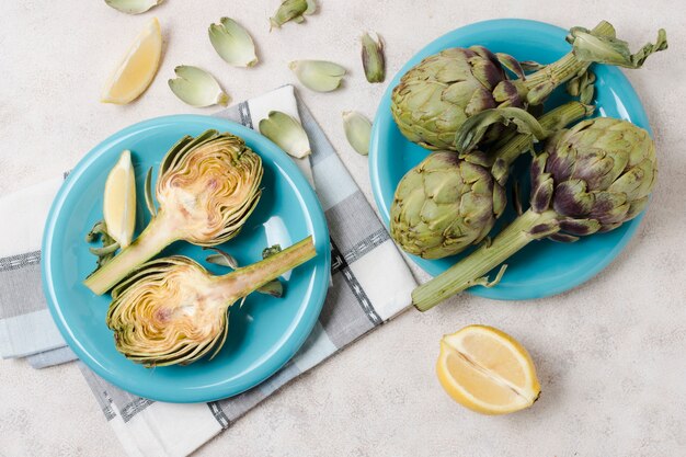 Top view of artichokes on plates