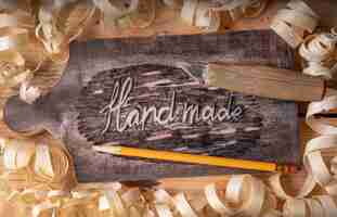 Free photo top view artisan jobs equipment and hand made words on wood