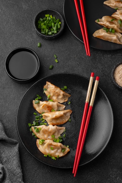 Top view of asian dish on plate with chopsticks