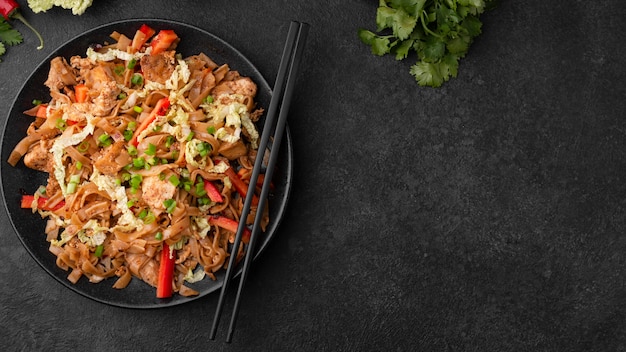 Free photo top view of asian dish with chopsticks and copy space