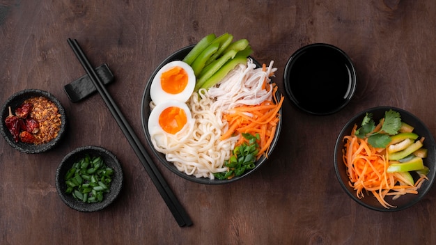 Top view of asian dish with eggs and salad