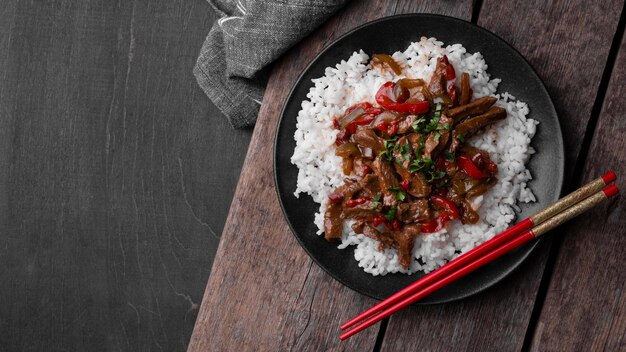 Top view of asian dish with rice and meat