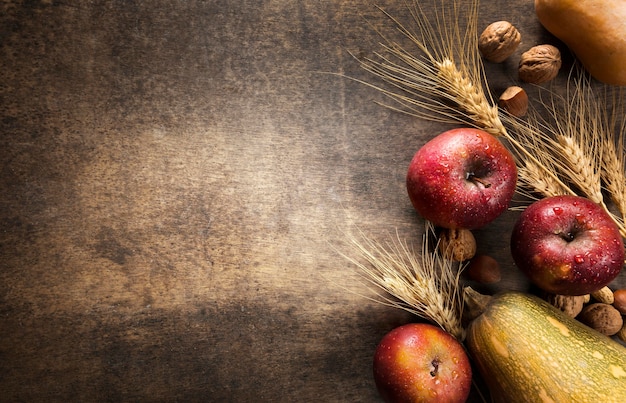 Top view of assortment of autumn fruits and vegetables with copy space