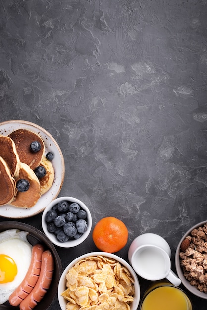 Top view of assortment of breakfast food with copy space