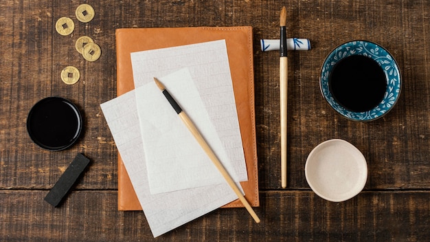 Top view assortment of chinese ink with empty card