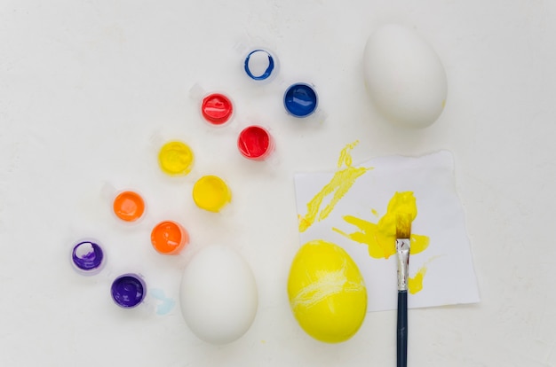 Top view of assortment of colorful paint for easter eggs