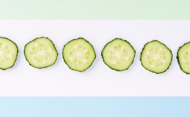 Top view assortment of cucumber slices with copy space