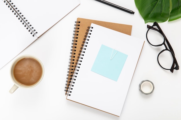 Top view assortment of desk elements with notebooks