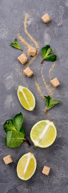 Top view assortment of different ingredients on cement background