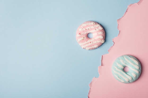 Top view of  assortment of glazed doughnuts with copy space