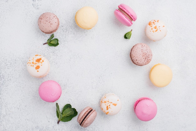 Free photo top view of assortment of macarons with mint