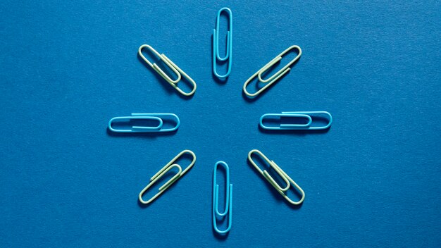 Top view assortment of paper clips on the table