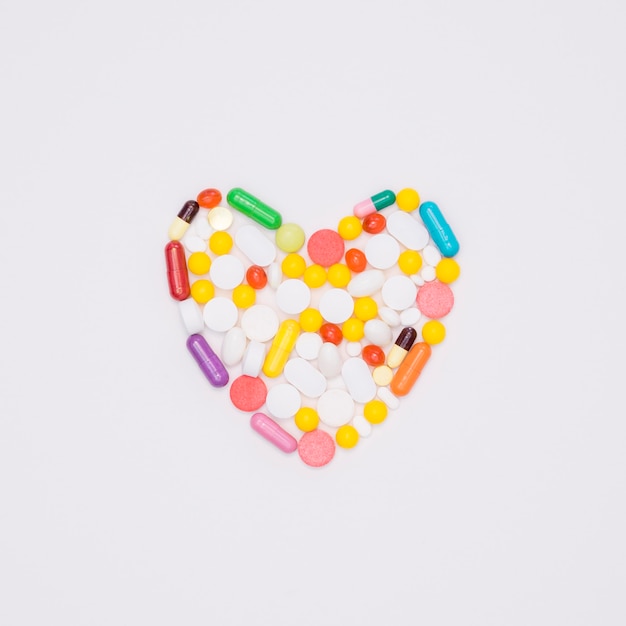 Top view of assortment of pills in heart shape